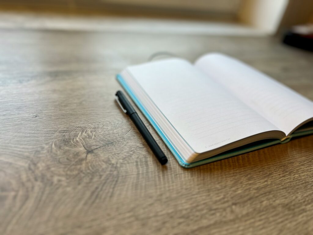 a pen on a book